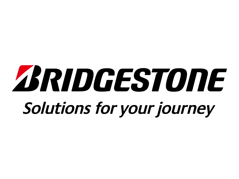 Das Bridgestone-Logo mit Bridgestone in fetten schwarzen Buchstaben und einem roten Akzent auf dem B, darüber der Slogan Solutions for your journey in kursiver schwarzer Schrift auf weißem Hintergrund.